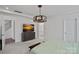 Bright and airy bedroom with decorative light fixture, carpeted floors and en suite bathroom at 9110 Buckley Ct # 154, Charlotte, NC 28269