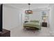 Serene bedroom with neutral tones, a tray ceiling, and ample natural light at 9110 Buckley Ct # 154, Charlotte, NC 28269