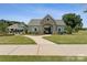 Beautiful community clubhouse with stone accents and lush green surroundings at 9110 Buckley Ct # 154, Charlotte, NC 28269