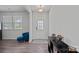 Bright foyer featuring wood-look flooring, a statement light fixture, and decorative furnishings at 9110 Buckley Ct # 154, Charlotte, NC 28269