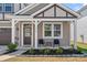 Charming front porch with chairs and landscaped garden welcomes you to this lovely home at 9110 Buckley Ct # 154, Charlotte, NC 28269