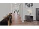 Hallway with wood-look floors and neutral wall paint at 9110 Buckley Ct # 154, Charlotte, NC 28269