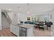 Open concept kitchen with granite countertops and stainless steel dishwasher at 9110 Buckley Ct # 154, Charlotte, NC 28269