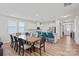 Open concept kitchen with white cabinets, stainless steel appliances, and eat-in breakfast bar at 9110 Buckley Ct # 154, Charlotte, NC 28269