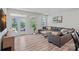 Comfortable living room with hardwood floors, large windows, and access to the patio at 9110 Buckley Ct # 154, Charlotte, NC 28269