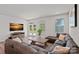 Spacious living room featuring a comfortable sofa and natural light at 9110 Buckley Ct # 154, Charlotte, NC 28269