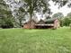 Brick house featuring a backyard with a deck at 965 Hunting Ave, Lincolnton, NC 28092