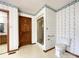 Full bathroom features floral wallpaper, shower, and toilet at 965 Hunting Ave, Lincolnton, NC 28092
