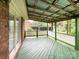 Covered deck with wooden beams and a view of the backyard at 965 Hunting Ave, Lincolnton, NC 28092