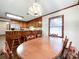 Eat-in kitchen shows dining table and wood chairs with view of bar seating area at 965 Hunting Ave, Lincolnton, NC 28092