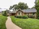Charming brick home with a well-manicured lawn and winding walkway at 965 Hunting Ave, Lincolnton, NC 28092