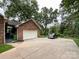 Brick garage with a long driveway and ample parking space at 965 Hunting Ave, Lincolnton, NC 28092