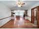 Spacious open floor plan with hardwood floors, ceiling fan, open to living room at 965 Hunting Ave, Lincolnton, NC 28092