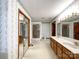 Spacious main bathroom with double vanity, shower, bathtub and lots of storage at 965 Hunting Ave, Lincolnton, NC 28092