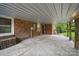 Back patio with access to the backyard and the side entrance into the home at 9818 Starwood Dr, Charlotte, NC 28215