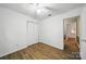 Bedroom featuring wood floors, closet, ceiling fan, and an abundance of natural light at 9818 Starwood Dr, Charlotte, NC 28215