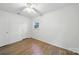 Bedroom featuring wood floors, natural light and neutral decor at 9818 Starwood Dr, Charlotte, NC 28215