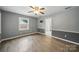 Bedroom showcasing hardwood flooring, neutral paint and fan at 9818 Starwood Dr, Charlotte, NC 28215