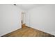 Bedroom featuring wood floors, natural light and neutral decor at 9818 Starwood Dr, Charlotte, NC 28215