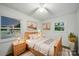 Bedroom with warm tones, wood floors, and natural light at 9818 Starwood Dr, Charlotte, NC 28215