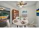 Charming breakfast nook featuring a round table, built-in bookcase, and bright natural light at 9818 Starwood Dr, Charlotte, NC 28215