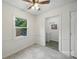 Dining room with white walls and neutral tiles, and a window at 9818 Starwood Dr, Charlotte, NC 28215