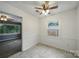 Bright dining area has a ceiling fan, large window, and direct access to the living room at 9818 Starwood Dr, Charlotte, NC 28215