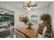 Dining room features a wooden table, decor, and direct access to the living room at 9818 Starwood Dr, Charlotte, NC 28215