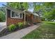 Charming brick home featuring manicured landscaping and inviting front entrance at 9818 Starwood Dr, Charlotte, NC 28215