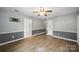 Living room featuring hardwood flooring, neutral paint, and ceiling fan at 9818 Starwood Dr, Charlotte, NC 28215