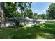 The backyard features a patio, lush lawn, mature trees, and a well-maintained exterior at 1035 15Th Nw Ave, Hickory, NC 28601
