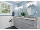 Elegant bathroom with double vanity, granite countertops, and modern fixtures at 1035 15Th Nw Ave, Hickory, NC 28601