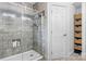 Shower with gray tile, glass doors and built in niche at 1035 15Th Nw Ave, Hickory, NC 28601