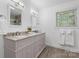 Elegant bathroom with double vanity, granite countertops, and wood floor at 1035 15Th Nw Ave, Hickory, NC 28601