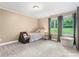 Cozy bedroom featuring neutral walls, plush gray carpet, and bright natural light from two windows at 1035 15Th Nw Ave, Hickory, NC 28601