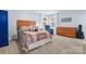 Bright bedroom with wood furniture, plush carpet, and a view of the yard at 1035 15Th Nw Ave, Hickory, NC 28601