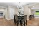 Open concept dining room has hardwood flooring, new light fixture, and access to the kitchen at 1035 15Th Nw Ave, Hickory, NC 28601