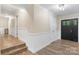 Bright foyer with dark front door, wood-look floors, and neutral paint at 1035 15Th Nw Ave, Hickory, NC 28601