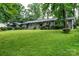 Charming brick home features a large lawn, updated windows, and mature landscaping at 1035 15Th Nw Ave, Hickory, NC 28601
