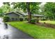 Landscaped yard with lush greenery and a beautiful walkway to the front door at 1035 15Th Nw Ave, Hickory, NC 28601