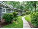 Landscaped yard with lush greenery and a beautiful walkway to the front door at 1035 15Th Nw Ave, Hickory, NC 28601