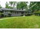 Attractive single-story home with manicured lawn and lush, verdant landscaping at 1035 15Th Nw Ave, Hickory, NC 28601