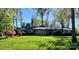 Charming single-story home with lush green lawn and mature trees at 1035 15Th Nw Ave, Hickory, NC 28601