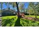 Well-maintained front yard with manicured lawn, landscaping, mature trees and flower beds at 1035 15Th Nw Ave, Hickory, NC 28601