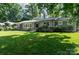 Charming single-story home with a manicured lawn and lush landscaping at 1035 15Th Nw Ave, Hickory, NC 28601