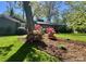Well-manicured yard with mature tree and colorful flowerbeds at 1035 15Th Nw Ave, Hickory, NC 28601