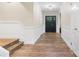 Hallway features beautiful wood flooring, fresh paint and front door with sidelight window at 1035 15Th Nw Ave, Hickory, NC 28601