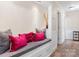 Hallway bench with grey seat cushion, pink pillows, and built-in storage at 1035 15Th Nw Ave, Hickory, NC 28601
