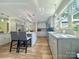 Bright eat-in kitchen with gray cabinets, stainless appliances, and granite countertops overlooking the backyard at 1035 15Th Nw Ave, Hickory, NC 28601
