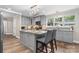 Kitchen featuring gray cabinets, granite countertops, stainless steel appliances, and eat-in island at 1035 15Th Nw Ave, Hickory, NC 28601